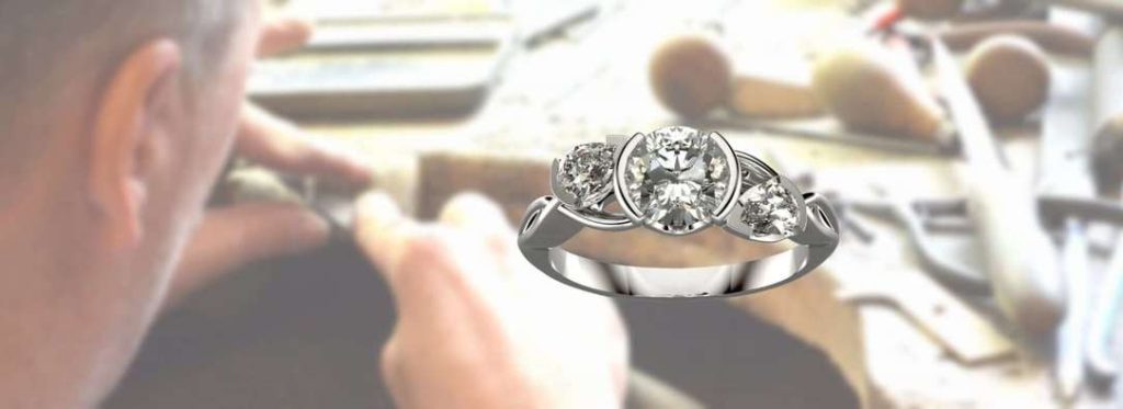 THE DIAMOND SIS APRILS BIRHSTONE SET IN A THREE STONE RING