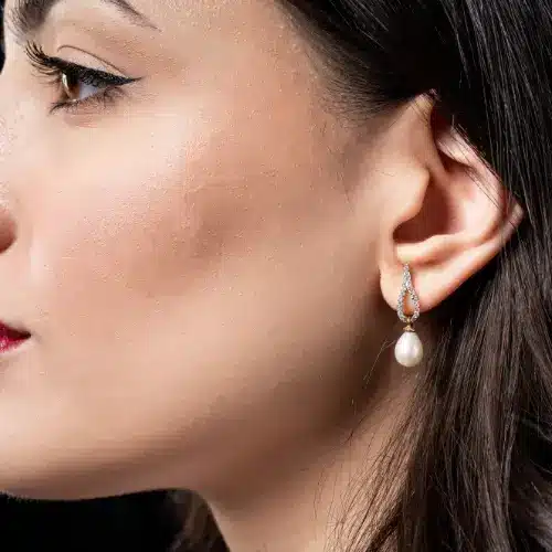 Model swearing a Bespoke diamond and pear drop Earring