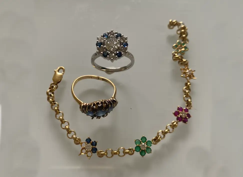 Two rings and a bracelet presented for jewellery appraisal.