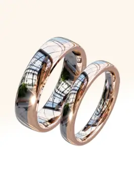 Polina's matching wedding rings crafted in platinum and rose gold, showcasing elegant design and craftsmanship.