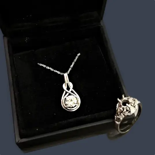 Upcycled jewellery featuring an original ring and a diamond pendant with chain