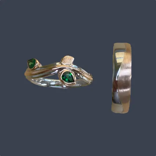 Ladies' emerald platinum and rose gold wedding ring and men's platinum and rose gold wedding ring created using repurposed gold