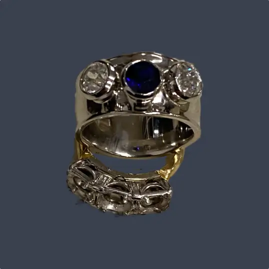 remodelled three stone sapphire and diamond engagement ring