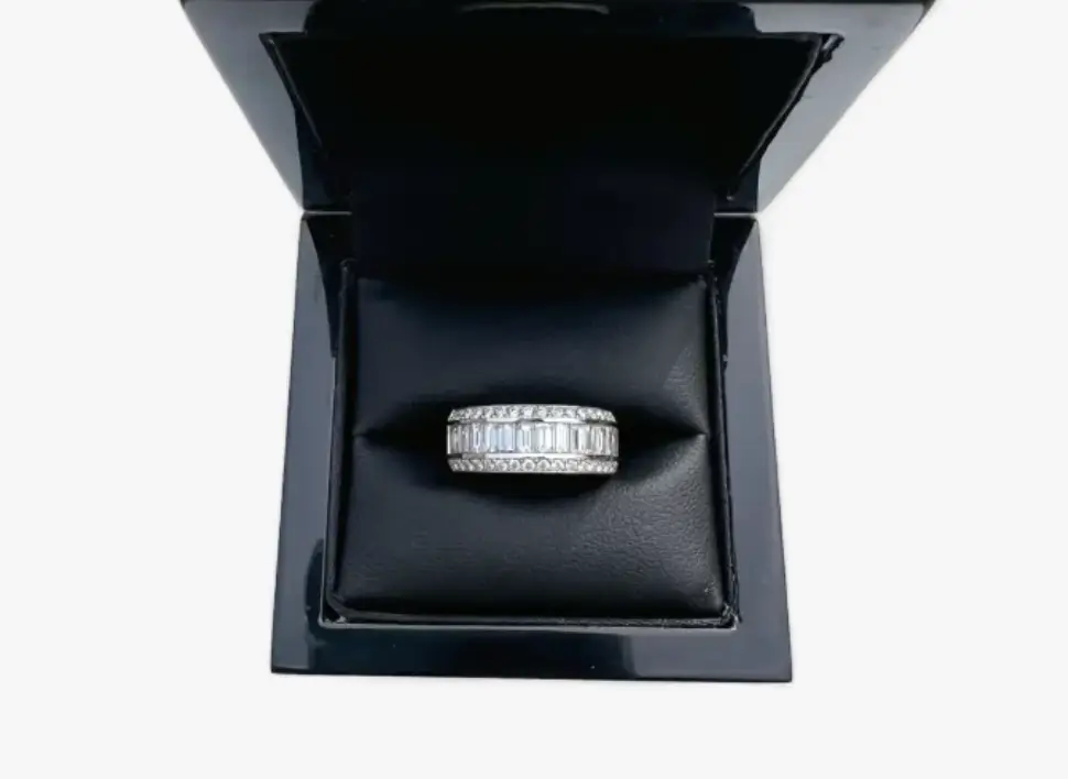 Lesbian engagement rings with a center row of baguette diamonds and brilliant-cut diamonds on either side