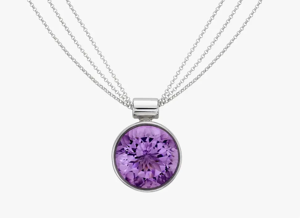 beautiful bezel set amethyst pendant on a three-row chain