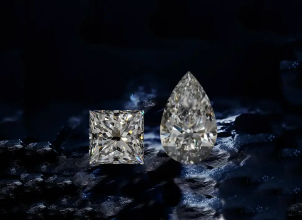 A princess-cut and pear-shaped lab-grown diamond displayed side by side, showcasing their brilliance and unique shapes.