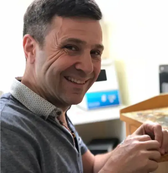 About David Law at his jewellery bench in London, hand-crafting a piece of bespoke jewellery