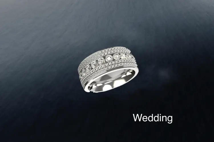 Diamond-encrusted wedding ring handcrafted in London, created through a bespoke design process to complement an engagement ring