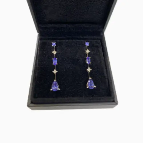 Tanzanite gemstones discovered on a client’s travels, thoughtfully designed into a bespoke pair of platinum drop earringsTanzanite gemstones discovered on a client’s travels, thoughtfully designed into a bespoke pair of platinum drop earrings