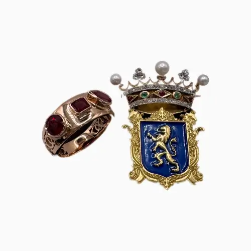 Gold signet ring set with rubies and enamel crest created from a bespoke design