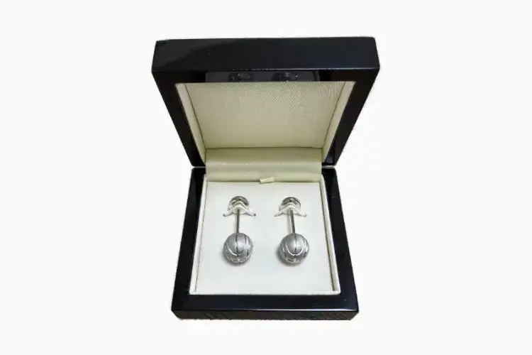 Custom 18ct white gold basketball cufflinks handcrafted by bespoke jewellery designer David Law