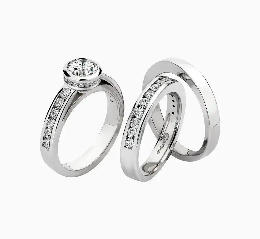 channel set diamond engagement ring with matching wedding and eternity ring