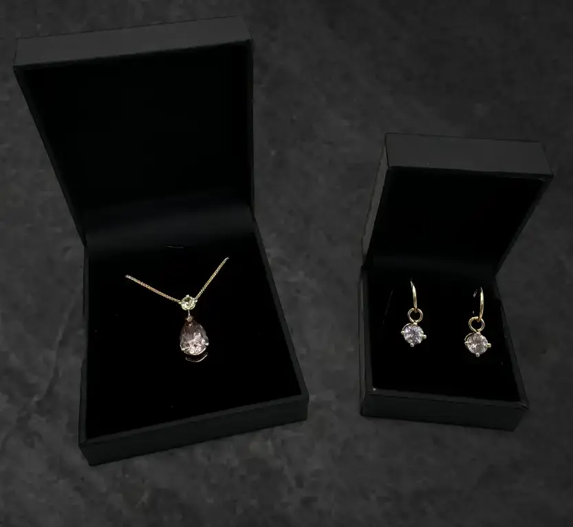 gemstones and diamonds repourposed into a drop neckace and earrings