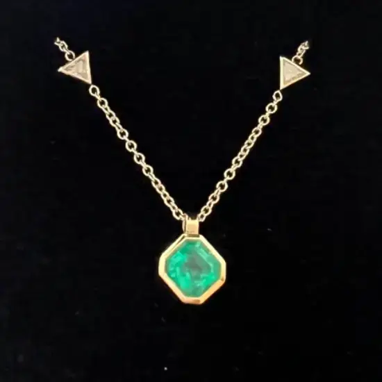 bespoke jewellery emerald and diamond necklace on a 18ct gold chain