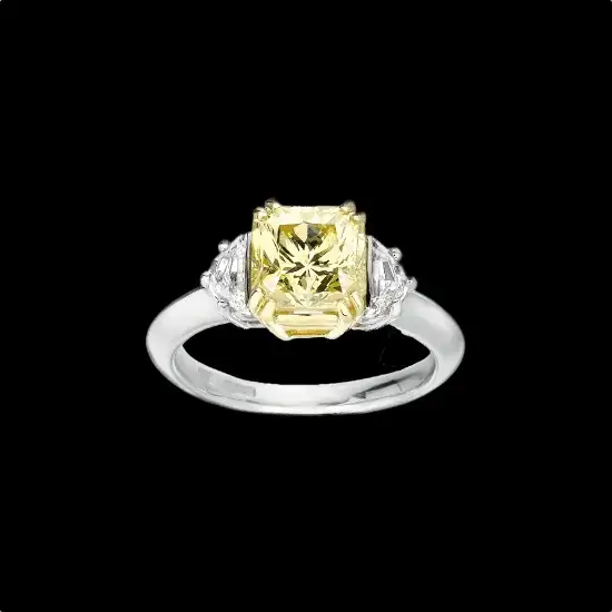 bespoke engagement ring with a natural yellow centre diamond and two side white diamonds