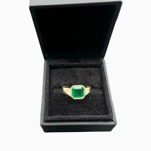 Square emerald and trillion diamond gemstone engagement ring