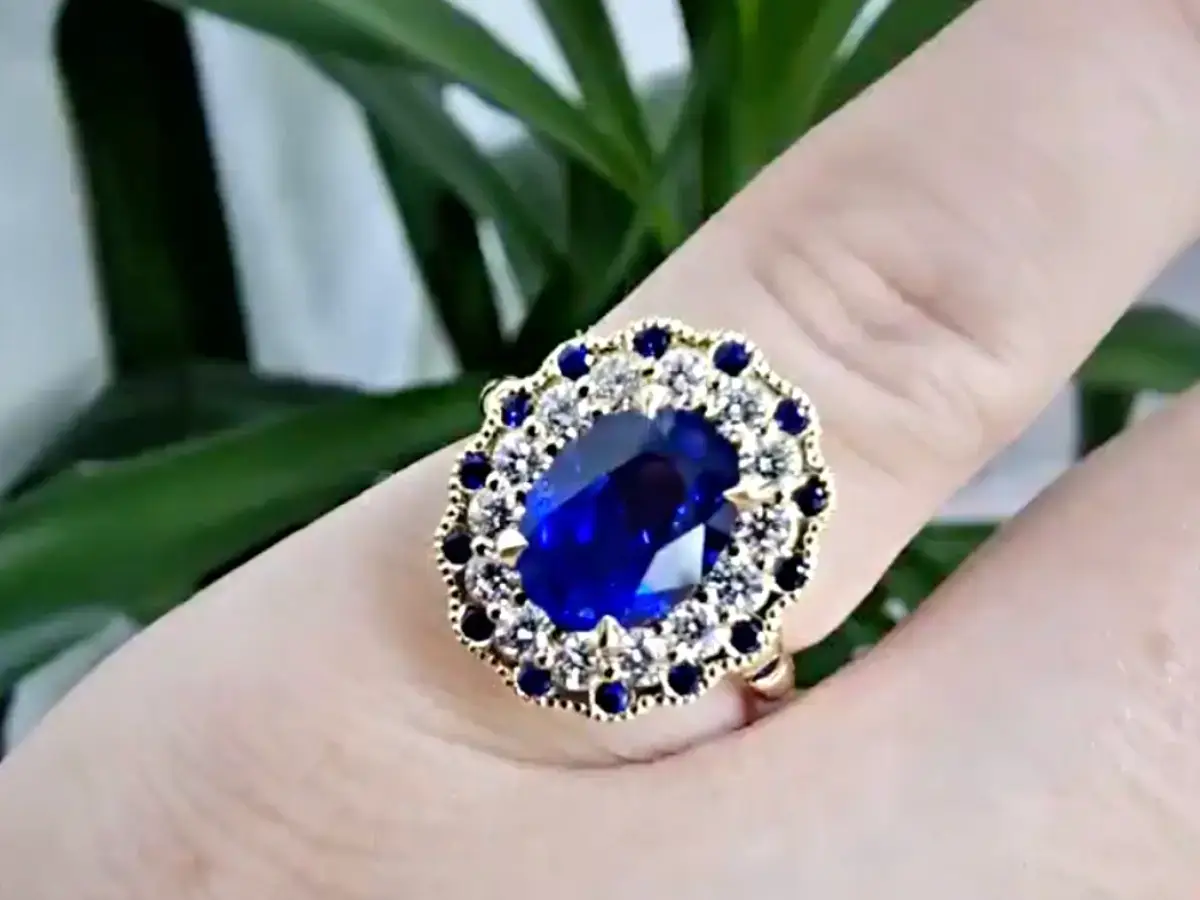 sapphire and diamond coloured gemstone engagement ring in 18ct yellow gold