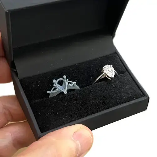 The wax ring proposal with two rings in a box - a temporary set with a gem and a wax ring